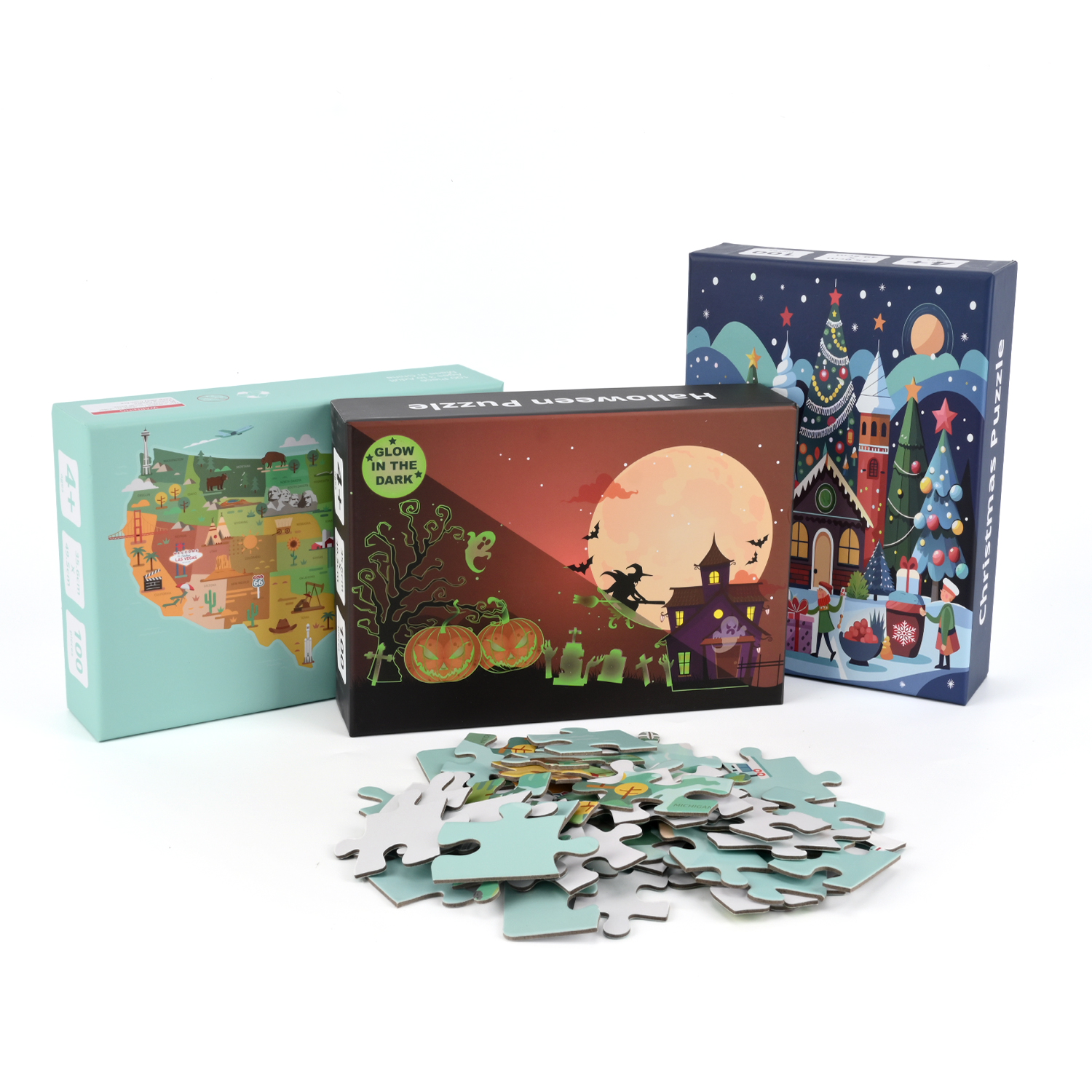 Three printed puzzle box designs displayed with loose puzzle pieces